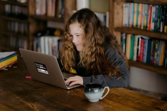 girl learning on a laptop